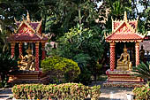 Vientiane, Laos - Pha That Luang, Other structures on the ground include a bell tower, several stupas, a number of pavilions sheltering images of the Buddha.  